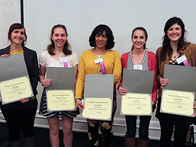 Five female award winners show their certificates