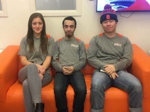 Three student ITS employees sit on a couch