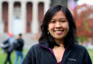 PhD Student smiles on the Quad