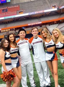 Hong Yang Chen (third from left) with members of the Syracuse University Cheer Team. (Image taken prior to COVID-19).